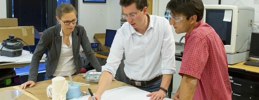 Photo of bioengineering postdoc Veronique Peiffer and graduate student Richard Timm working with lecturer Ross Venook.
