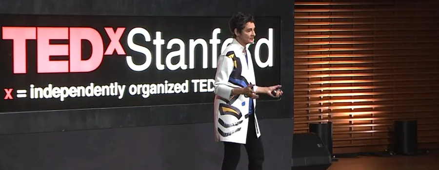 Dr. Carla Shatz delivering the TEDxStanford talk.