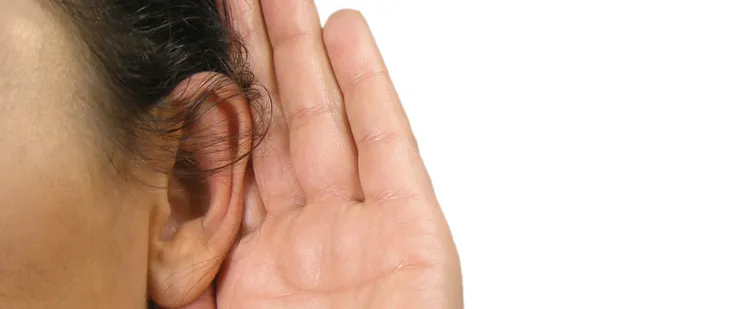 Photo of person experiencing hearing loss.