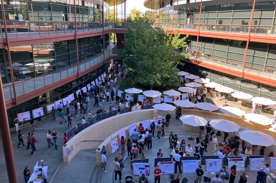 Outdoor overhead photo showing a large scientific poster session taking place in the Clark Center Courtyard.
