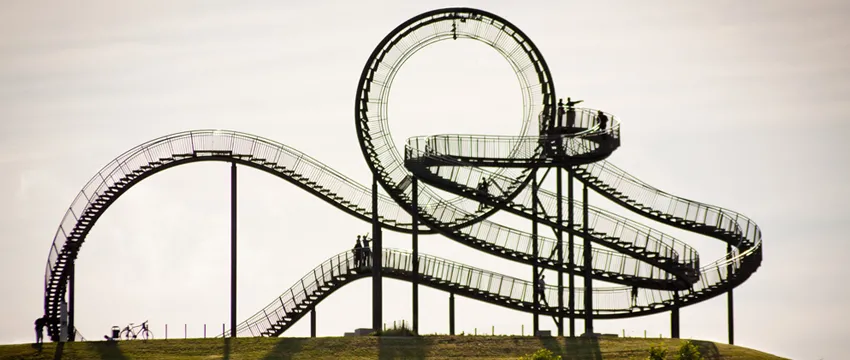 Photo of walkable roller coaster in Germany, with pathways which wrap around themselves and one large full upside-down loop at the top.
