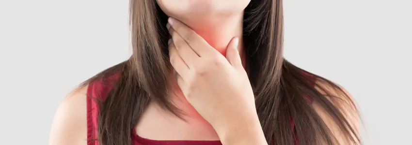 Photo of a woman holding a hand to her throat, with throat lit up in red to indicate pain.
