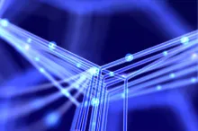 Graphic illustration of intersecting nanotubes lit up in blue against a darker background.