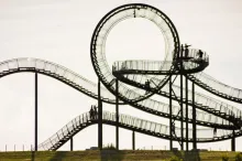 Photo of walkable roller coaster in Germany, with pathways which wrap around themselves and one large full upside-down loop at the top.