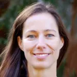 Photo of smiling white female faculty member with long brown hair, Dr. Gerlinde Wernig, Assistant Professor of Pathology at Stanford University.