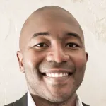 Photo of a smiling Black male faculty member, Dr. Sanmi Koyejo, Assistant Professor of Computer Science at Stanford University.